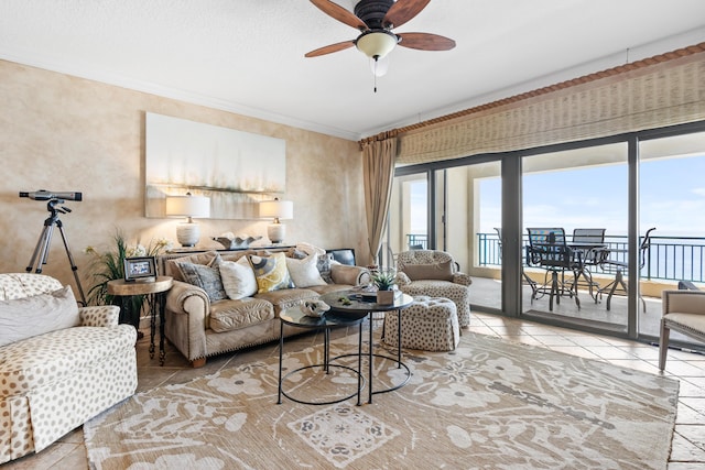 living room with crown molding and ceiling fan