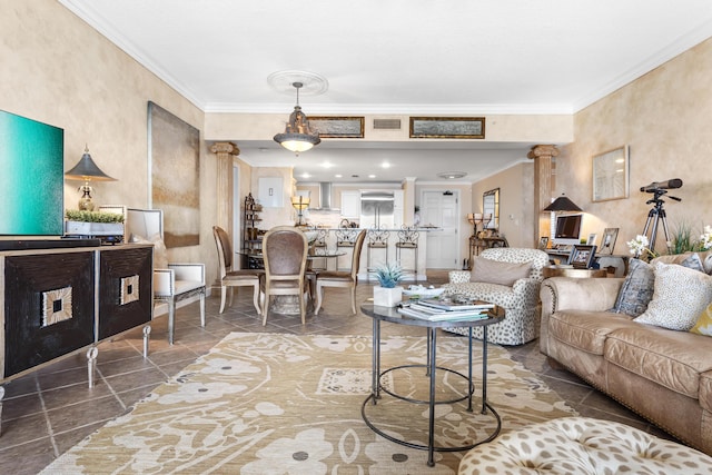 living room featuring ornate columns and crown molding