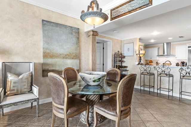 tiled dining room with crown molding