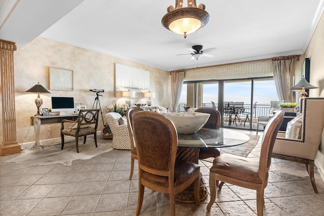 dining area featuring ceiling fan and ornamental molding