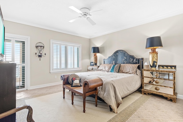 bedroom with multiple windows, ceiling fan, light tile patterned floors, and ornamental molding