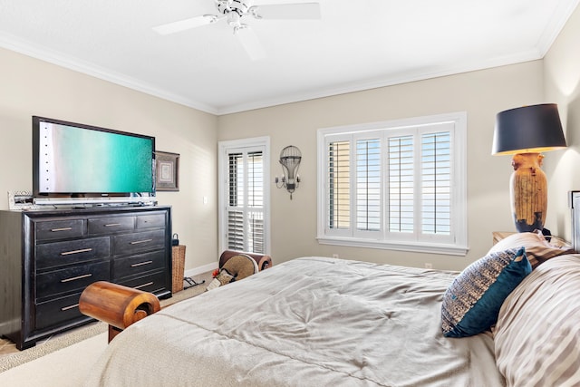 bedroom featuring multiple windows, ornamental molding, and ceiling fan