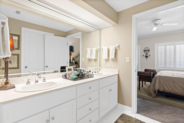 bathroom featuring tile patterned flooring, vanity, and ceiling fan