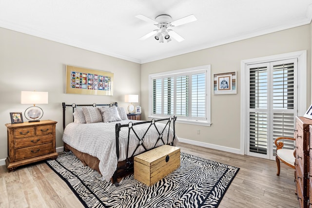 bedroom featuring ceiling fan, light hardwood / wood-style flooring, and ornamental molding