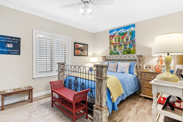 bedroom with ceiling fan, light hardwood / wood-style floors, and ornamental molding