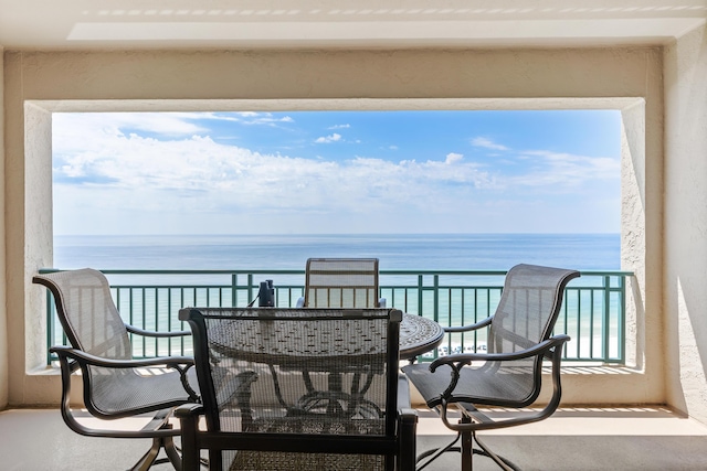 balcony featuring a water view