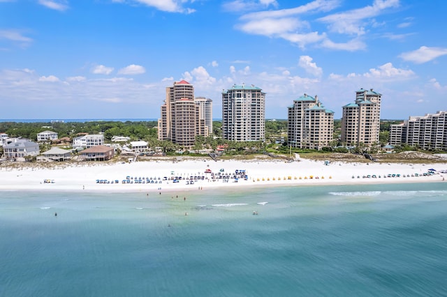 birds eye view of property featuring a water view and a view of the beach