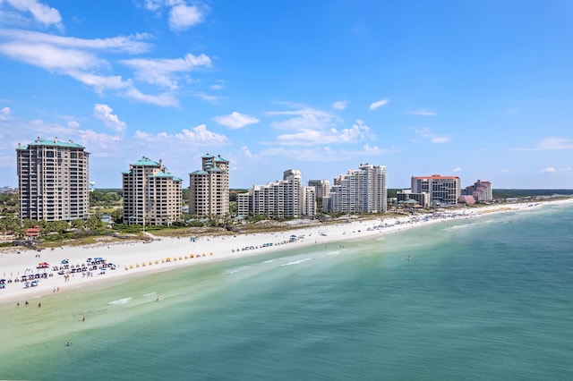 bird's eye view with a water view and a beach view