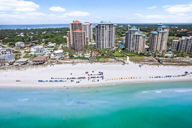 birds eye view of property featuring a water view and a view of the beach