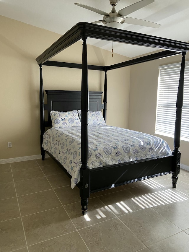 bedroom with tile patterned floors, ceiling fan, and lofted ceiling