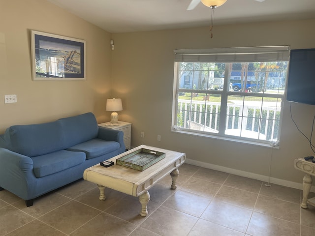 living room with tile patterned floors, ceiling fan, and lofted ceiling