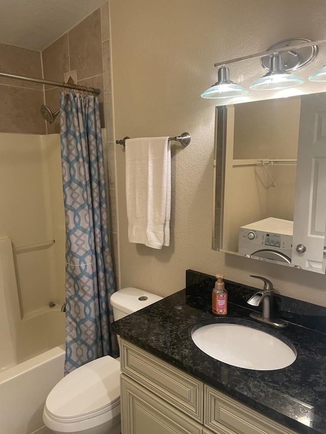 full bathroom featuring vanity, toilet, washer / dryer, and shower / tub combo