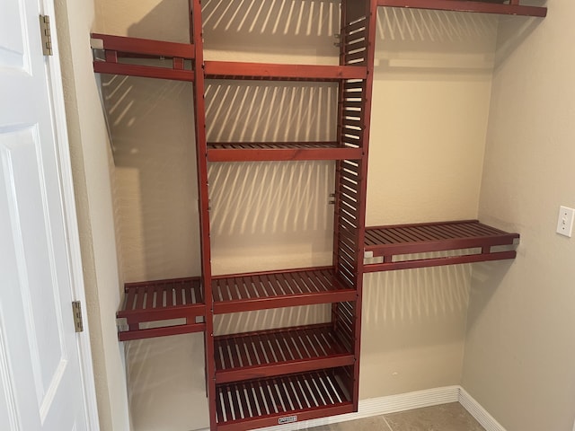 spacious closet featuring tile patterned floors