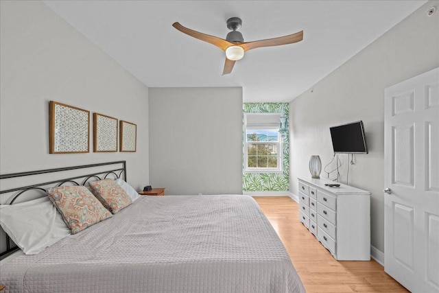 bedroom with ceiling fan and light hardwood / wood-style flooring