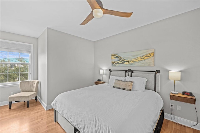 bedroom featuring ceiling fan and light hardwood / wood-style flooring