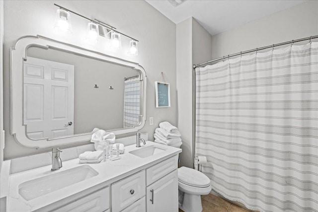 bathroom with tile patterned floors, a shower with curtain, vanity, and toilet