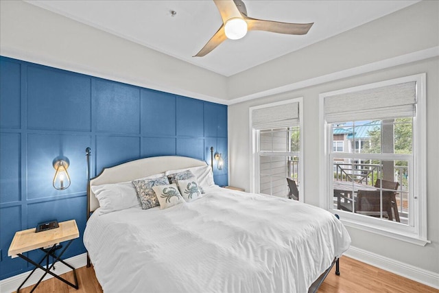 bedroom with hardwood / wood-style floors and ceiling fan