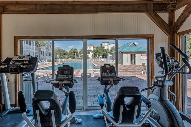 exercise room featuring vaulted ceiling