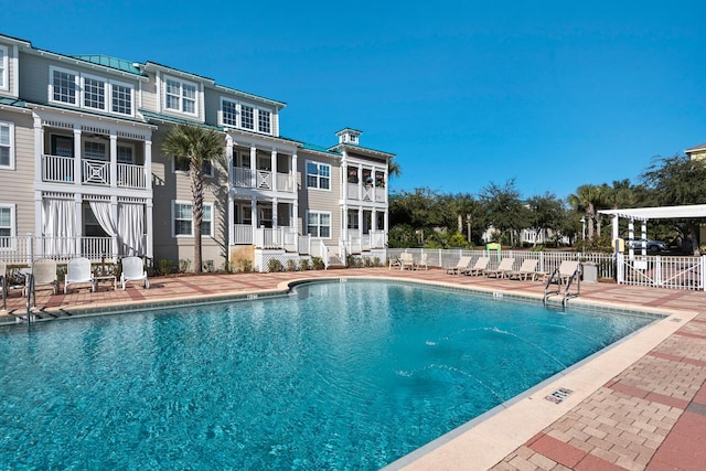 view of swimming pool with a patio