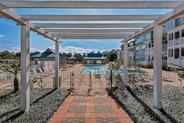 view of swimming pool featuring a patio area and a pergola