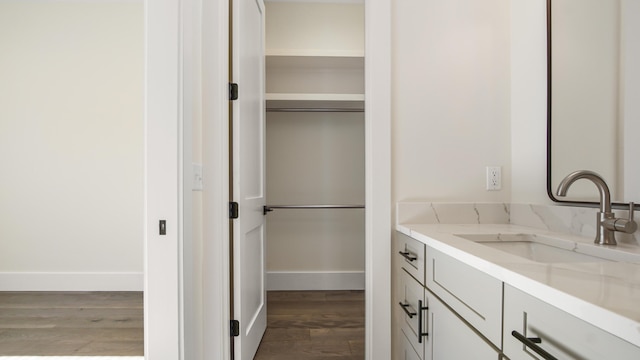 bathroom with vanity and hardwood / wood-style flooring