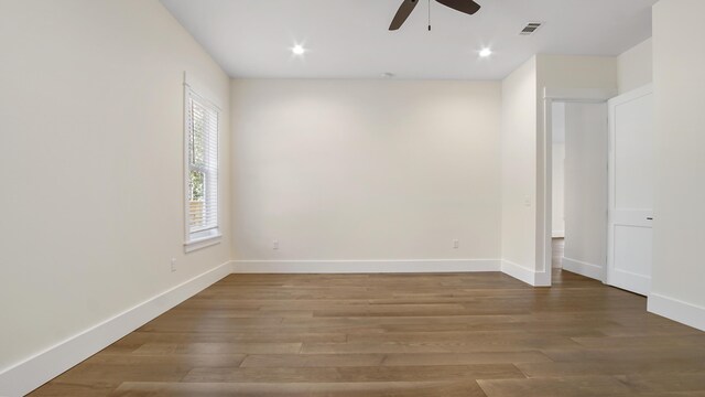 spare room featuring ceiling fan and wood-type flooring