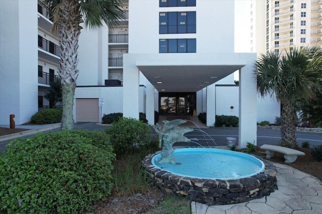 exterior space with pool water feature