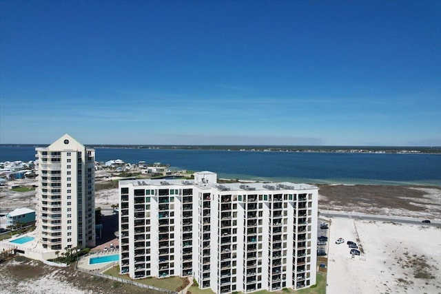 drone / aerial view featuring a beach view and a water view