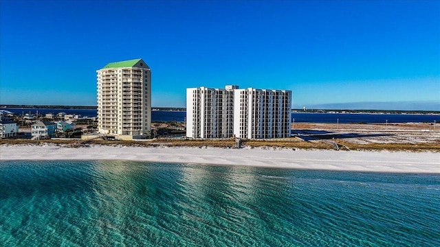 bird's eye view featuring a beach view and a water view