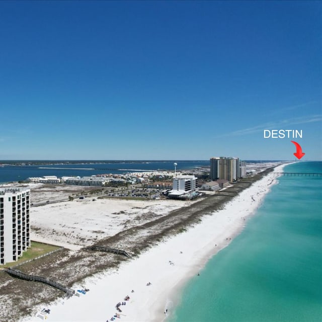 bird's eye view with a water view and a view of the beach