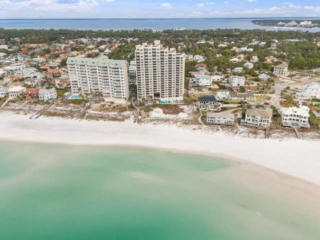 birds eye view of property featuring a water view and a view of the beach