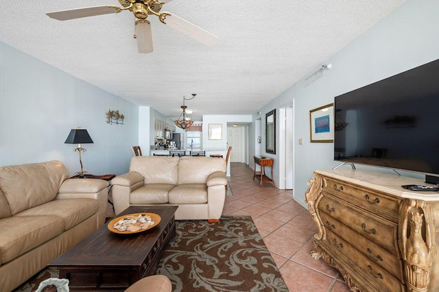 9815 US Highway 98 W Unit 1602, Miramar Beach, FL 32550 - living room featuring a textured ceiling, light tile patterned floors, and ceiling fan