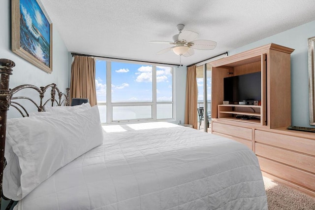 9815 US Highway 98 W Unit 1602, Miramar Beach, FL 32550 - bedroom featuring a textured ceiling and ceiling fan