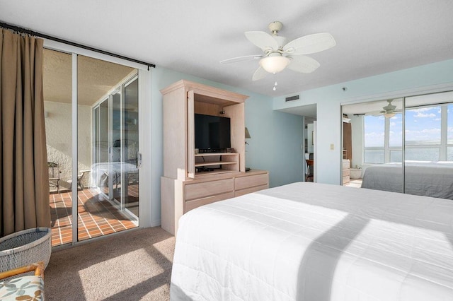 carpeted bedroom featuring access to exterior and ceiling fan