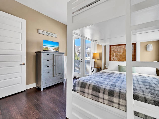 bedroom featuring access to exterior and dark hardwood / wood-style floors