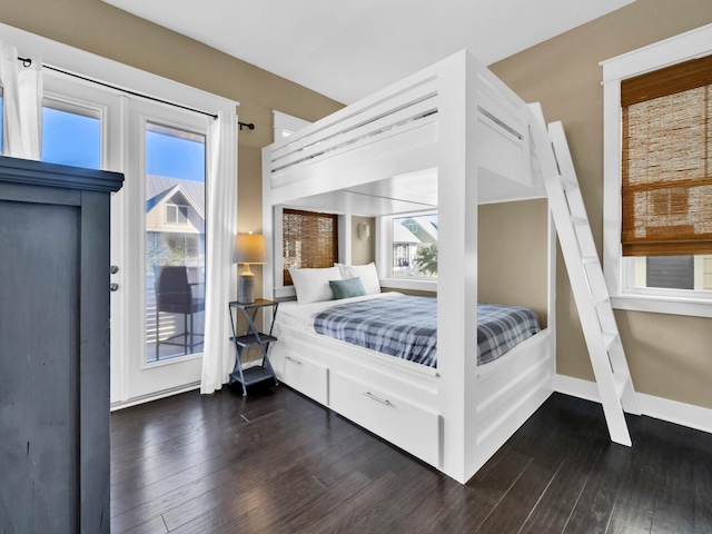 bedroom with dark hardwood / wood-style flooring