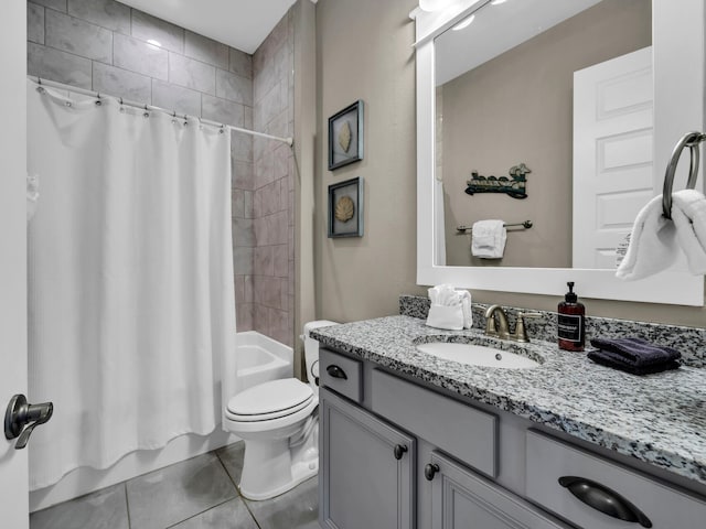 full bathroom featuring tile patterned floors, vanity, shower / tub combo, and toilet