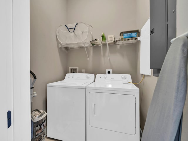 laundry area with independent washer and dryer