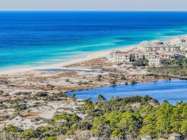 bird's eye view with a water view and a view of the beach