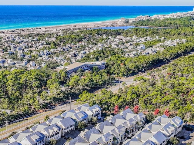 birds eye view of property featuring a view of the beach and a water view