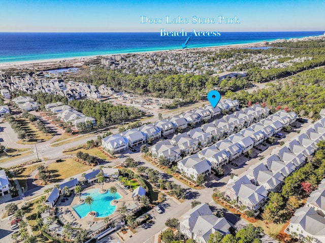 aerial view featuring a water view and a beach view