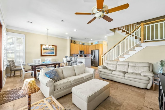 living room with ceiling fan with notable chandelier and ornamental molding