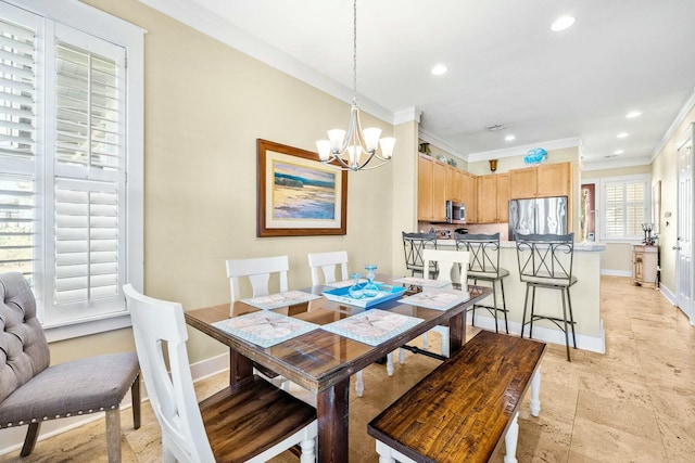 dining room featuring crown molding and a notable chandelier