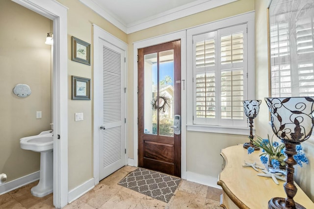 entryway with sink and ornamental molding