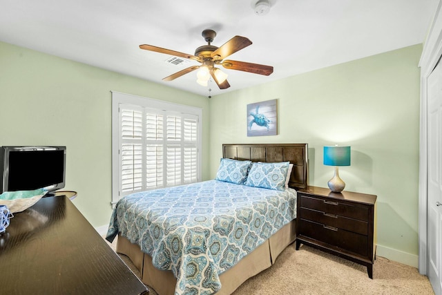 carpeted bedroom featuring ceiling fan