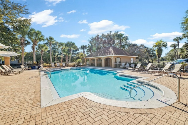 view of swimming pool with a patio area