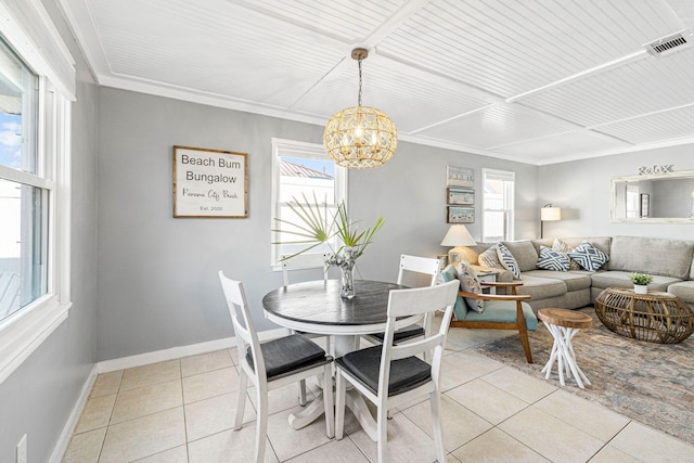 dining space featuring a healthy amount of sunlight, visible vents, baseboards, and light tile patterned floors