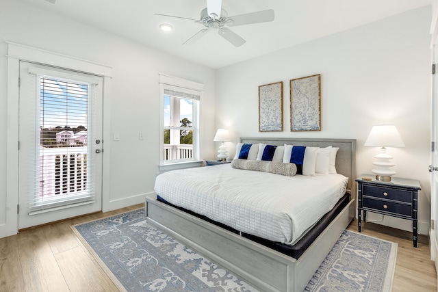 bedroom with access to outside, ceiling fan, and light hardwood / wood-style flooring