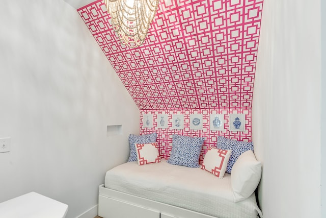 bedroom featuring a chandelier and vaulted ceiling