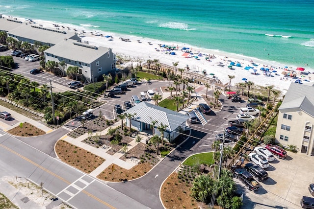 bird's eye view featuring a view of the beach and a water view